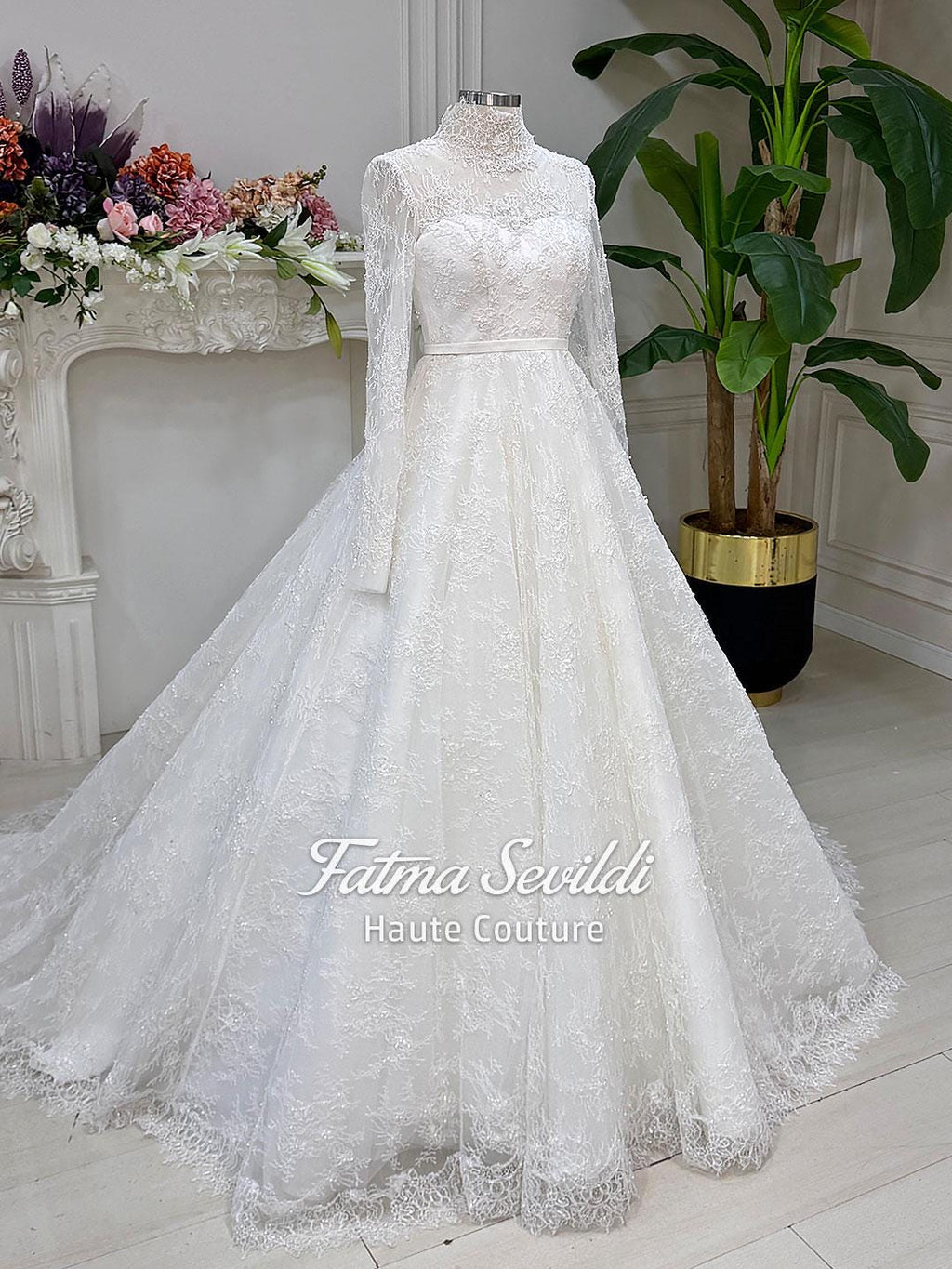 Elegant white lace wedding gown with high neck, long sleeves, floral embroidery, corset back, beads and veil