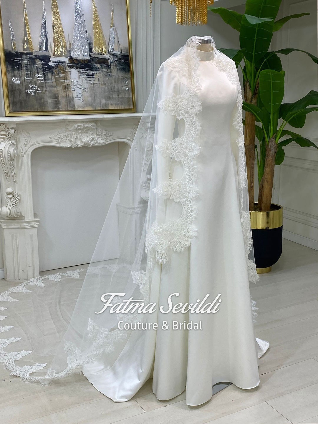 Veiled satin hijab wedding dress with long sleeves, lace veil, and floral appliques