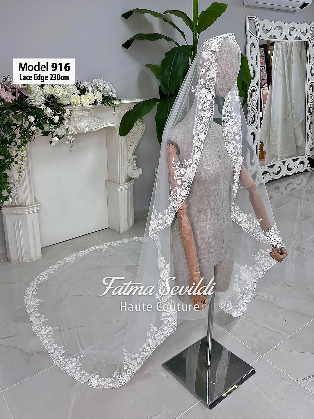Delicate 230cm white lace bridal veil with floral embroidery on mannequin