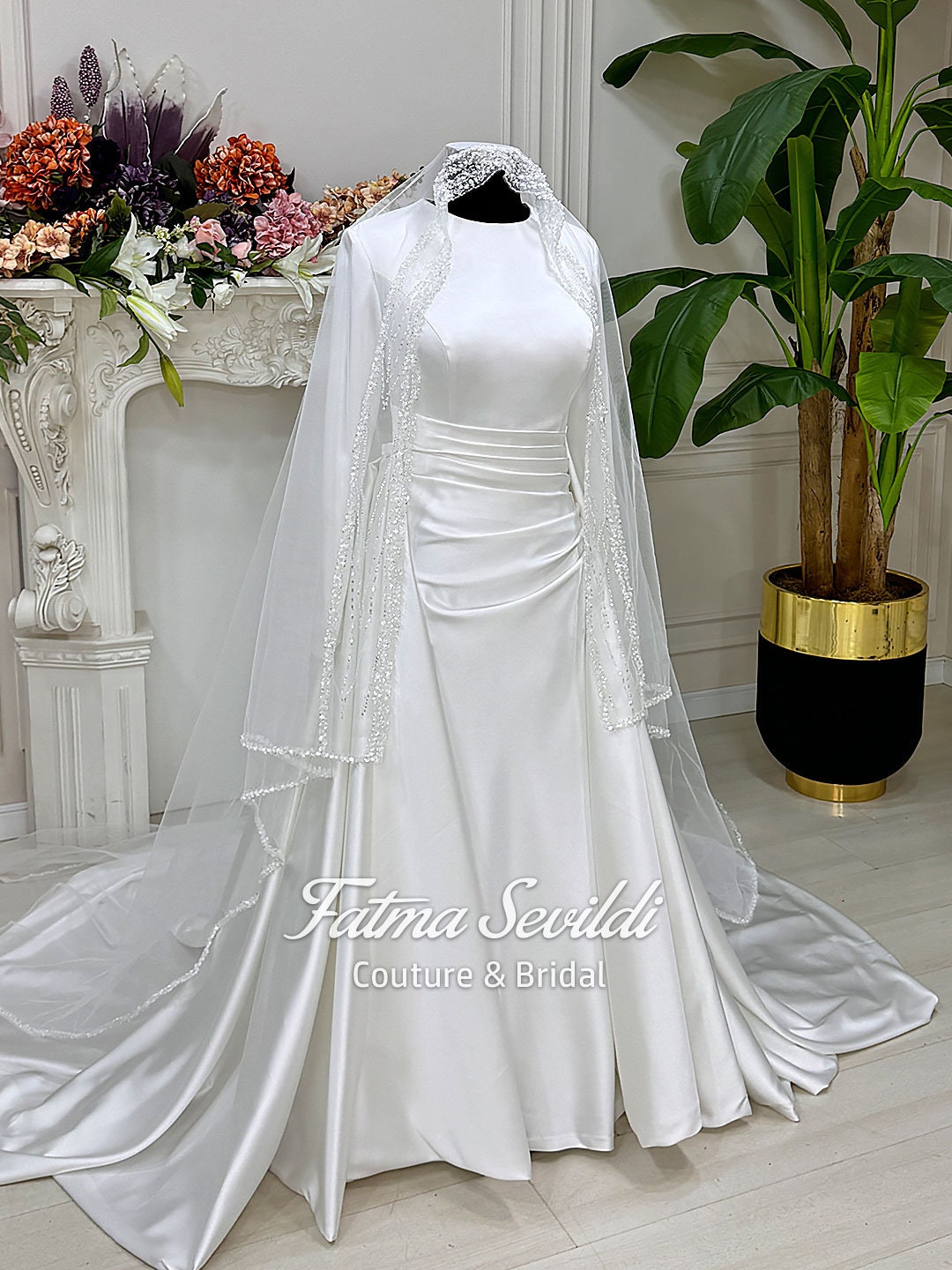 Elegant veiled satin Muslim wedding dress with long sleeves and lace trim