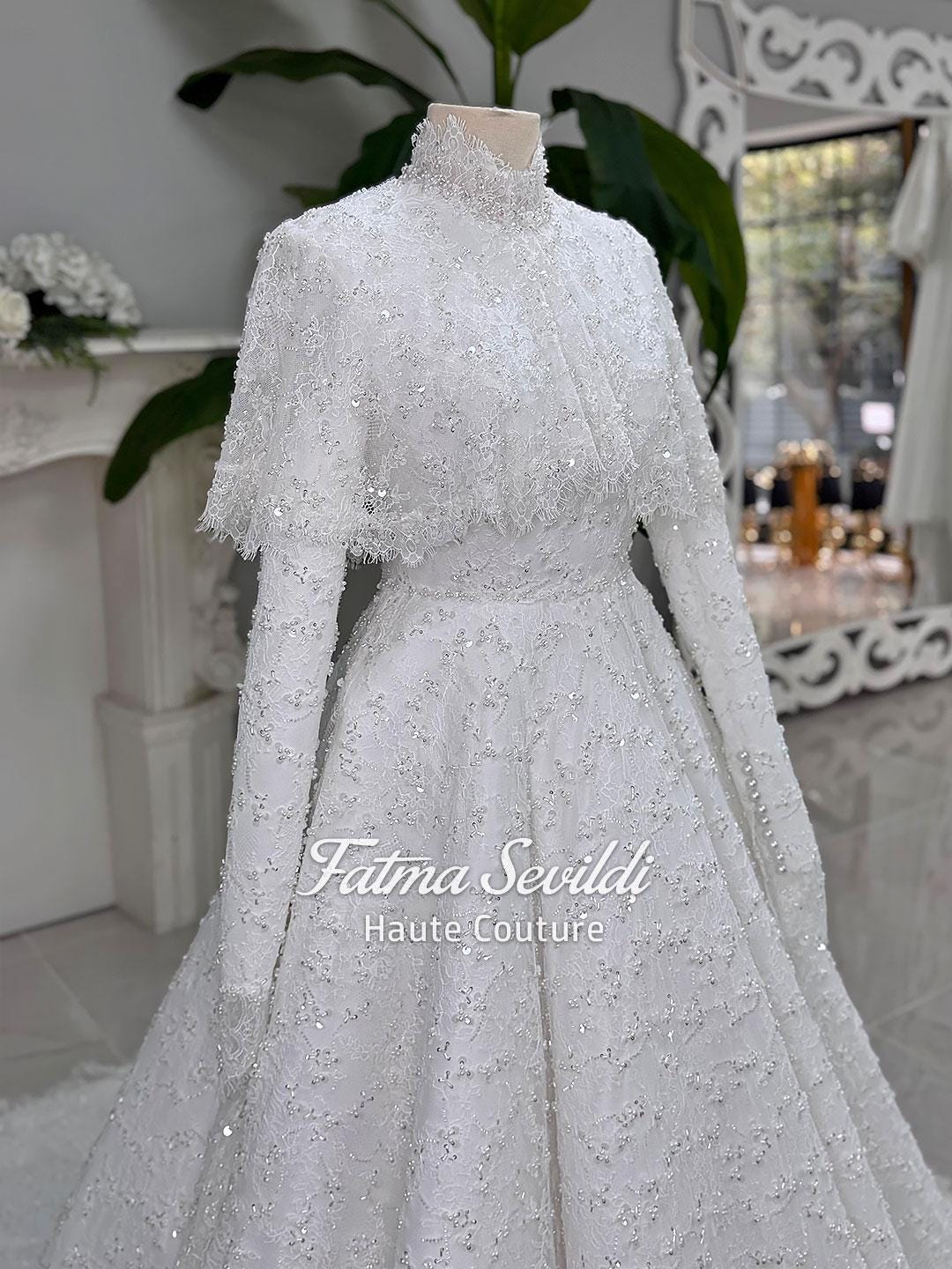 Elegant veiled hijab wedding dress with beaded lace cape, high neck, long sleeves