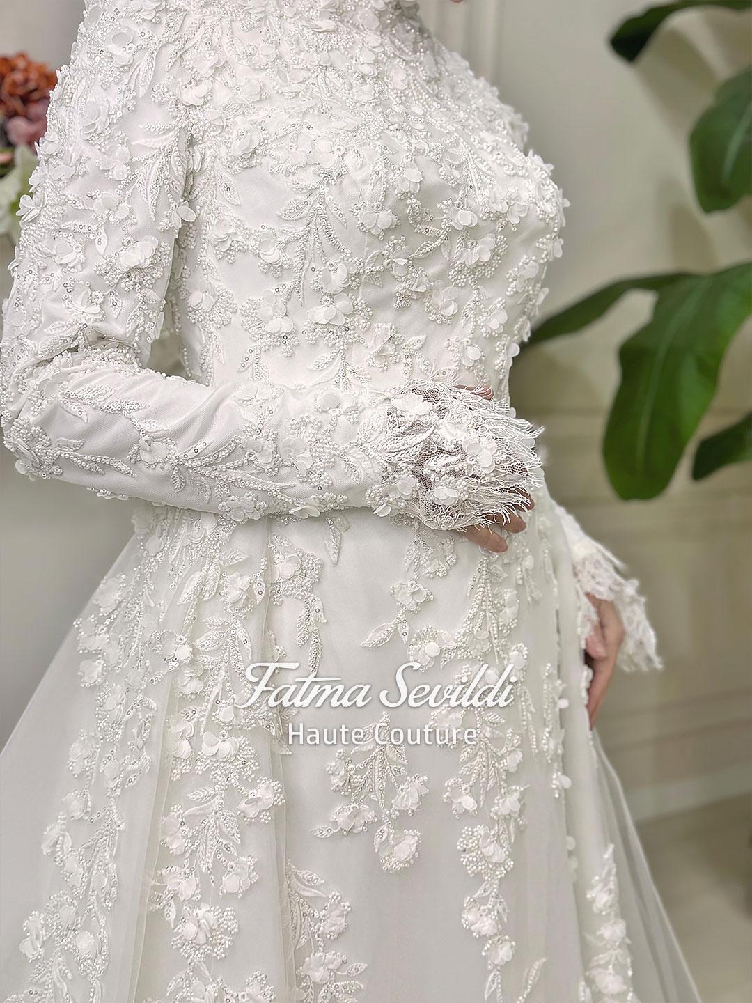 Elegant white mermaid hijab wedding dress with high neck, long sleeves, 3D lace and detachable skirt