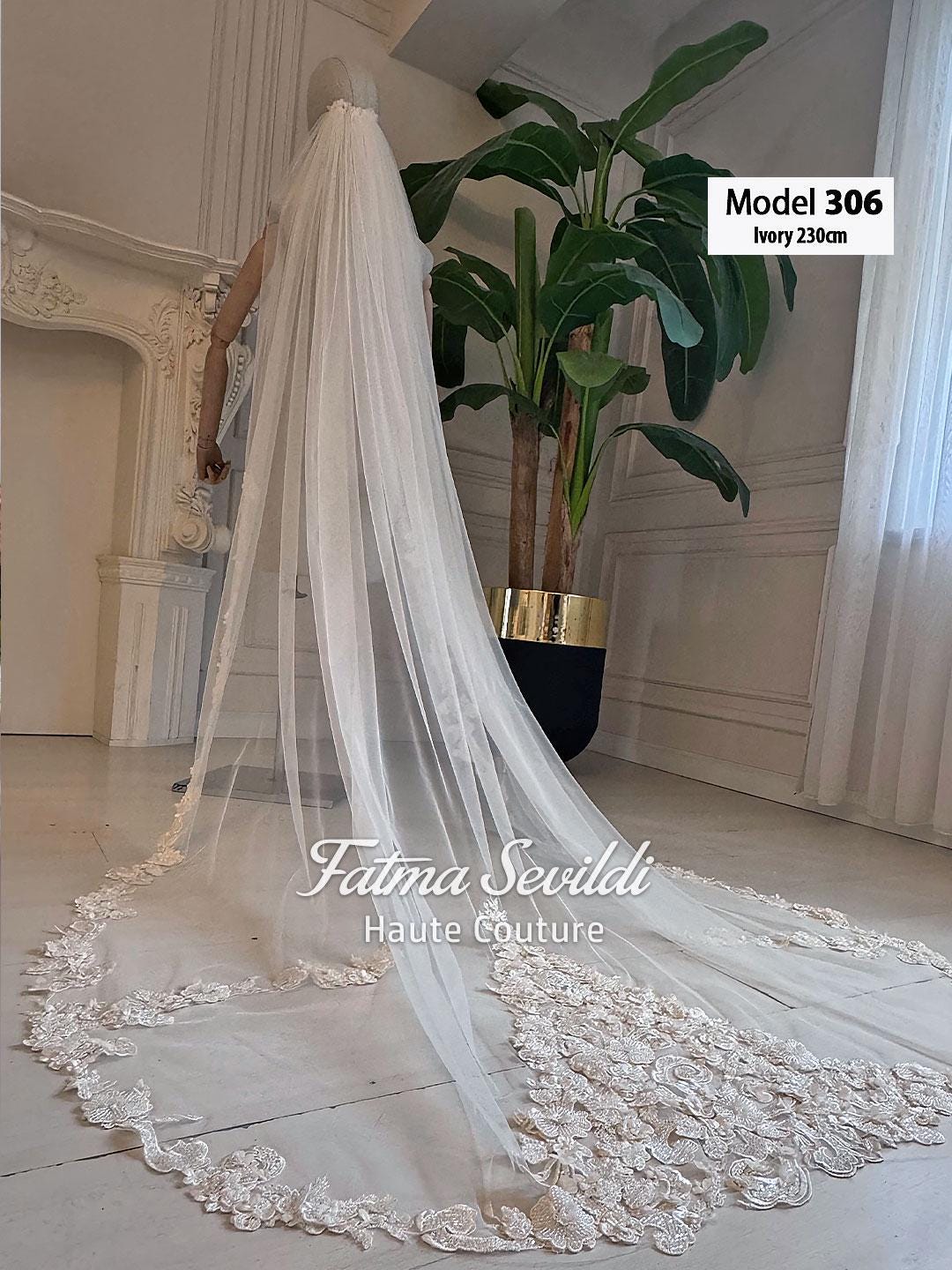 Ivory lace bridal veil with beaded floral embroidery and mantilla edge