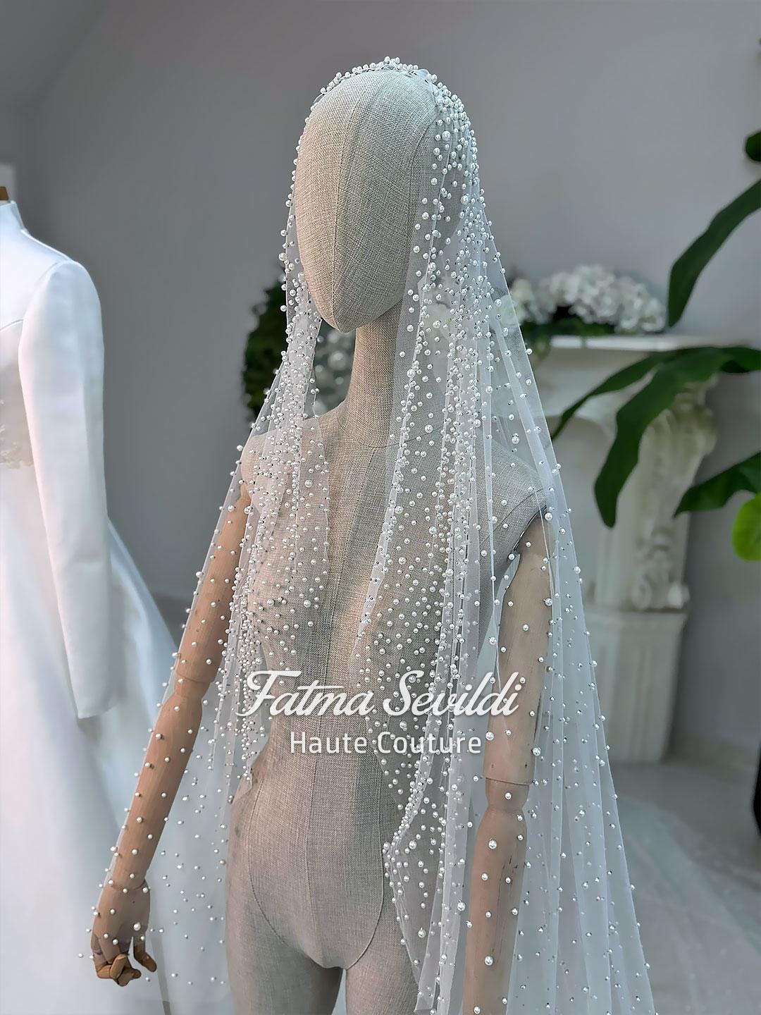 Elegant high-neck satin A-line hijab wedding dress with pearl veil