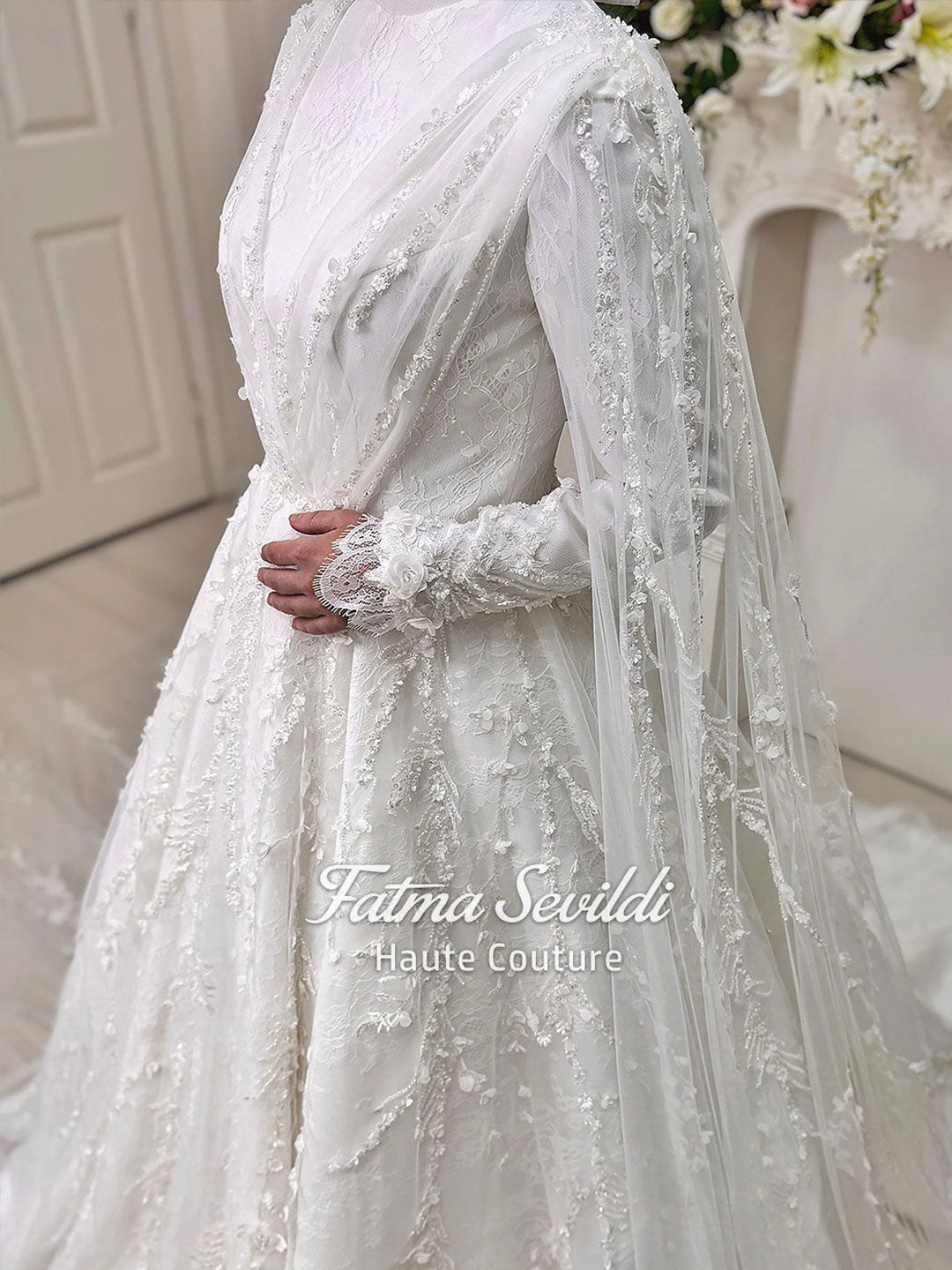 Elegant white floral lace Muslim wedding gown by Fatma Sevildi, long sleeve A-line with veil