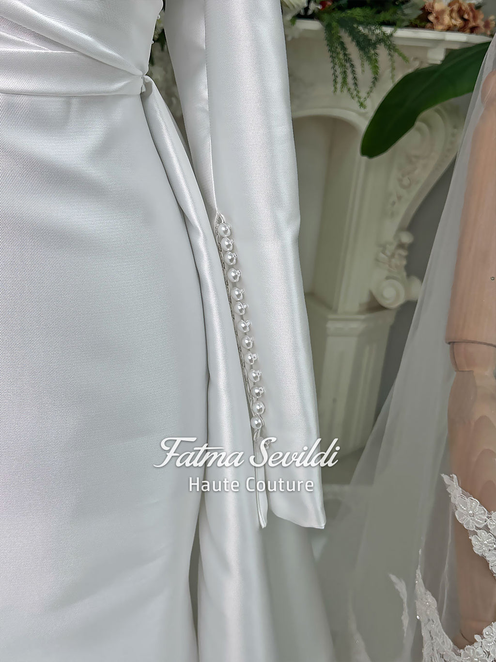 Luxury satin hijab wedding dress with off-shoulder long sleeves and an A-line silhouette, shown with premium lace veil and dramatic train. Custom couture modest bridal gown design with elegant draping and pearl details.