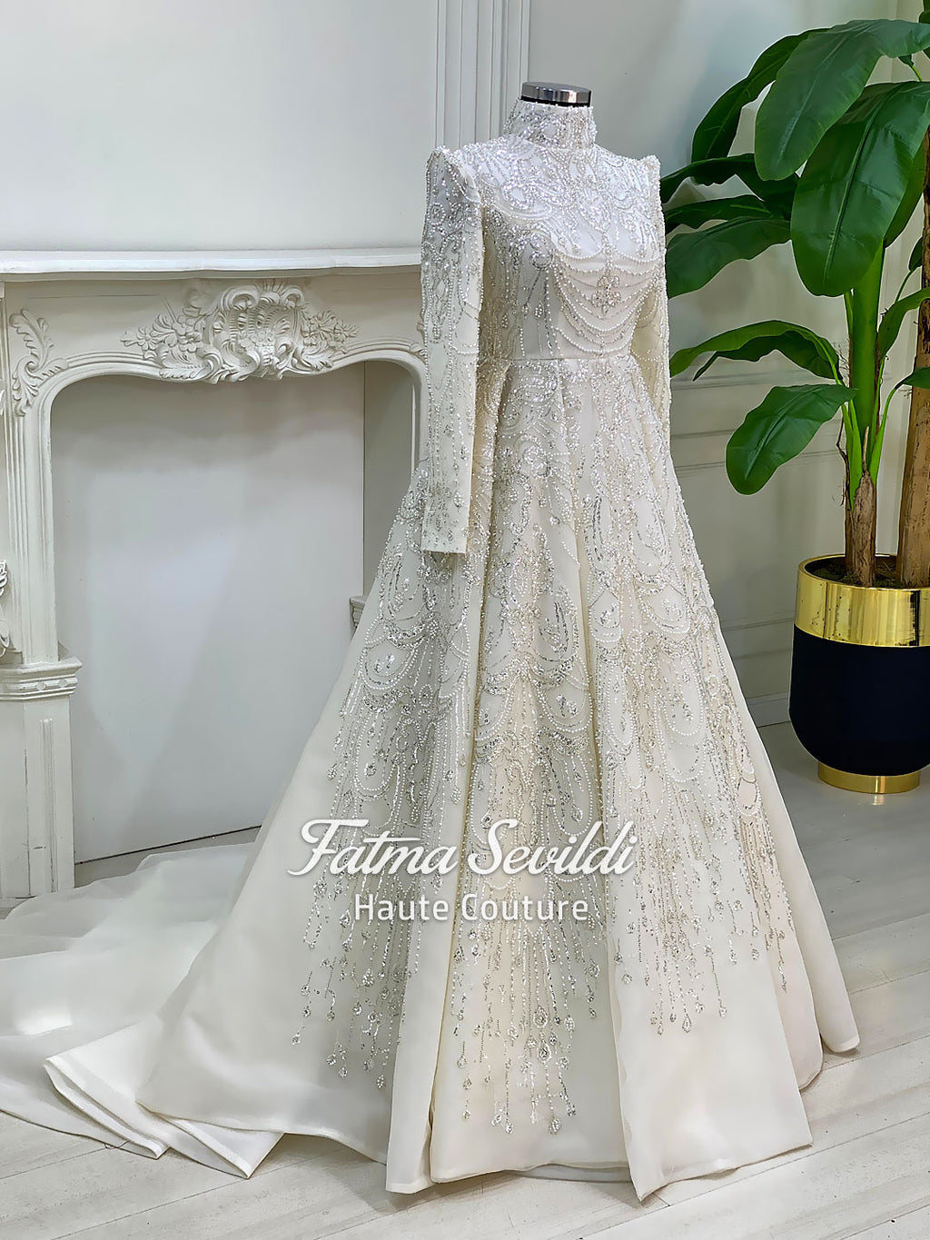 Luxury hijab wedding dress with high neck, long sleeves, and hand-beaded lace on an A-line modest bridal gown, custom made.