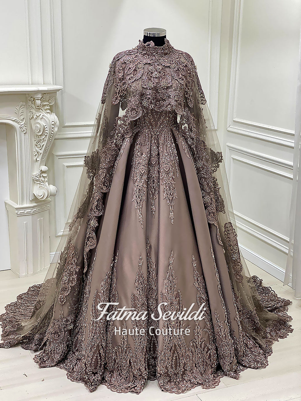 Luxury hijab wedding dress with long cloak, beaded lace detailing, and full-coverage modest ballgown silhouette. Custom made bridal gown with couture craftsmanship and elegant train.