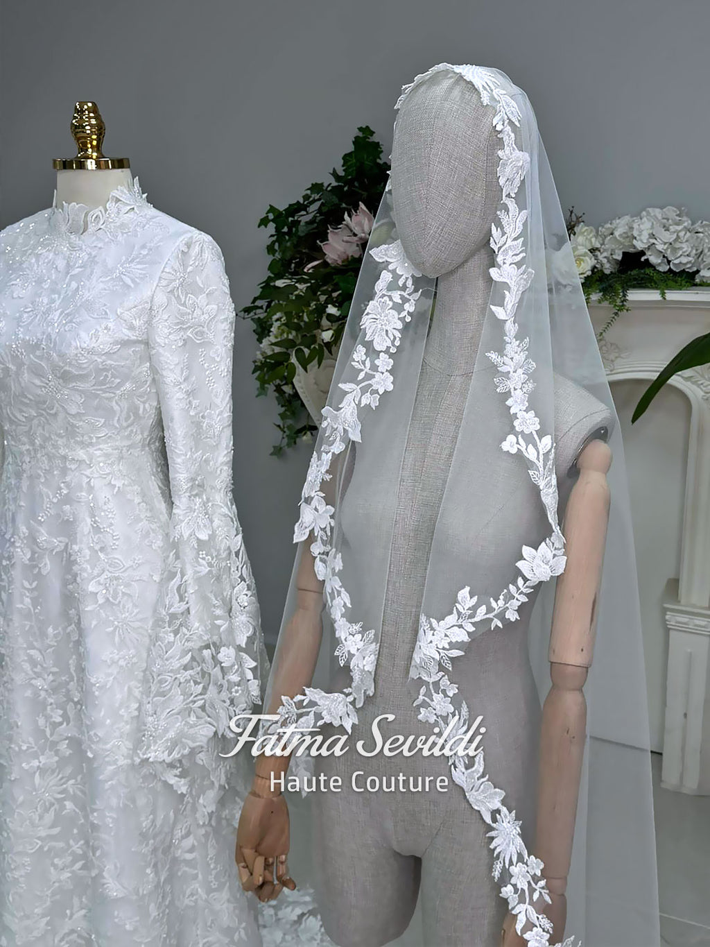 Veiled hijab wedding dress with high neck, long sleeves, and beaded floral lace in an elegant A-line couture silhouette.