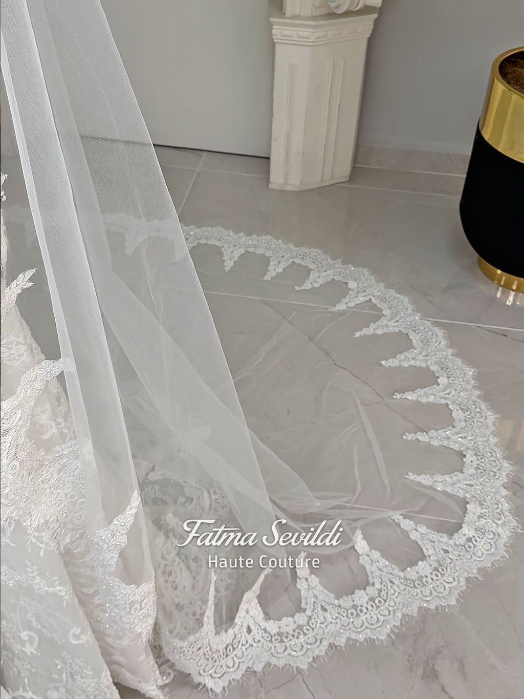 Luxury hijab wedding dress with mermaid silhouette and basque corset, featuring long sleeves, high neck lace, and a premium lace veil. Photographed on a mannequin in a bridal atelier setting.