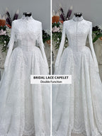 Off-white hijab wedding dress by Fatma Sevildi with beaded floral lace, a basque waist, long sleeves and a high neckline.