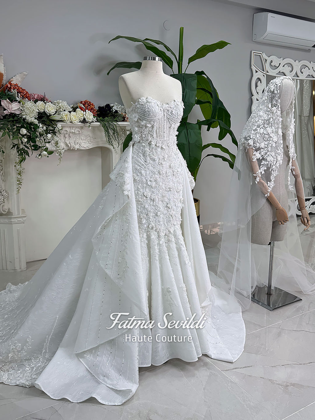 3-in-1 white hijab wedding dress with a beaded mermaid gown, detachable overskirt and long sleeve high-neck bridal topper. Convertible modest bridal set with dimensional floral lace and a coordinating lace veil.