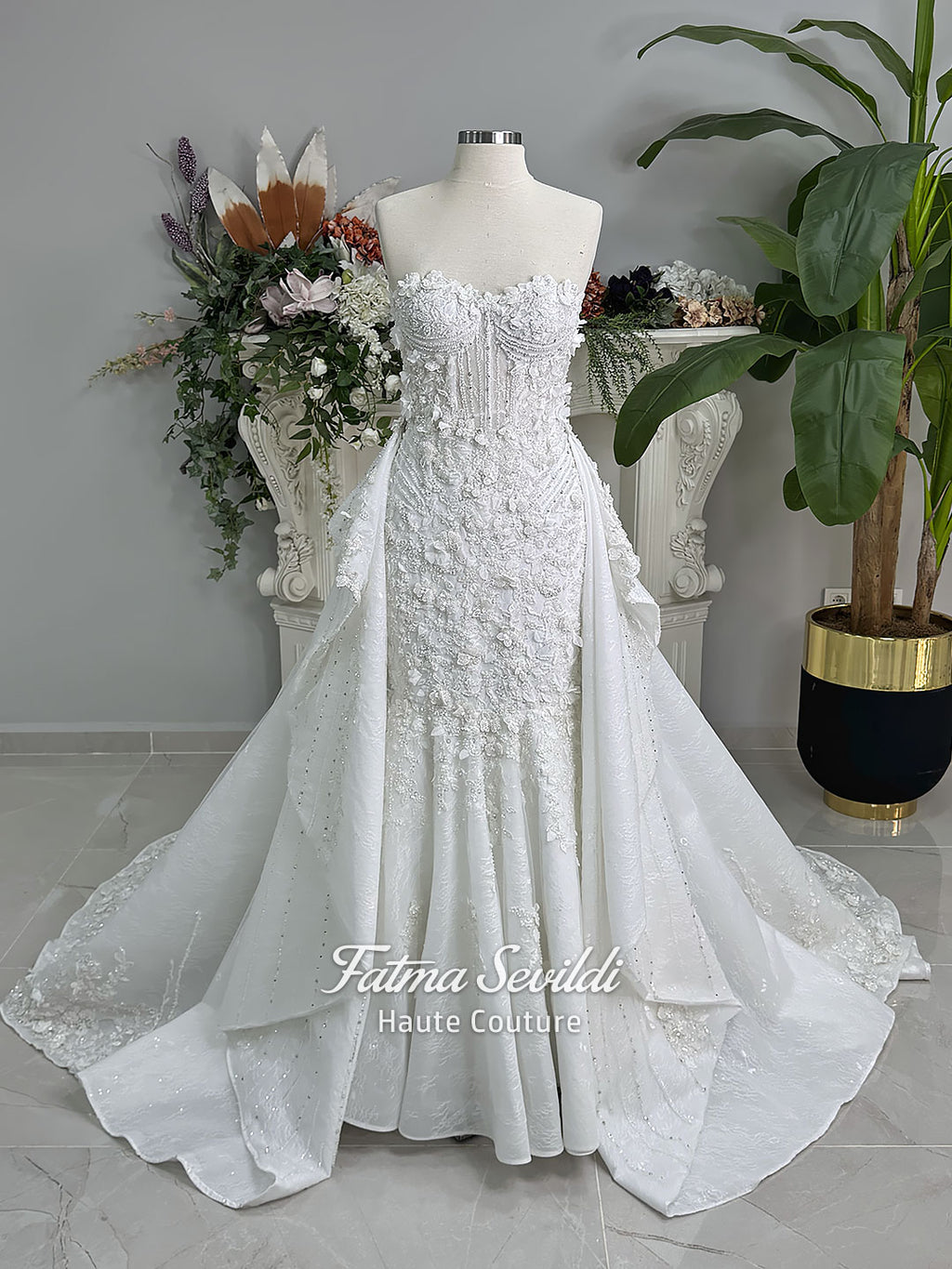 3-in-1 white hijab wedding dress with a beaded mermaid gown, detachable overskirt and long sleeve high-neck bridal topper. Convertible modest bridal set with dimensional floral lace and a coordinating lace veil.