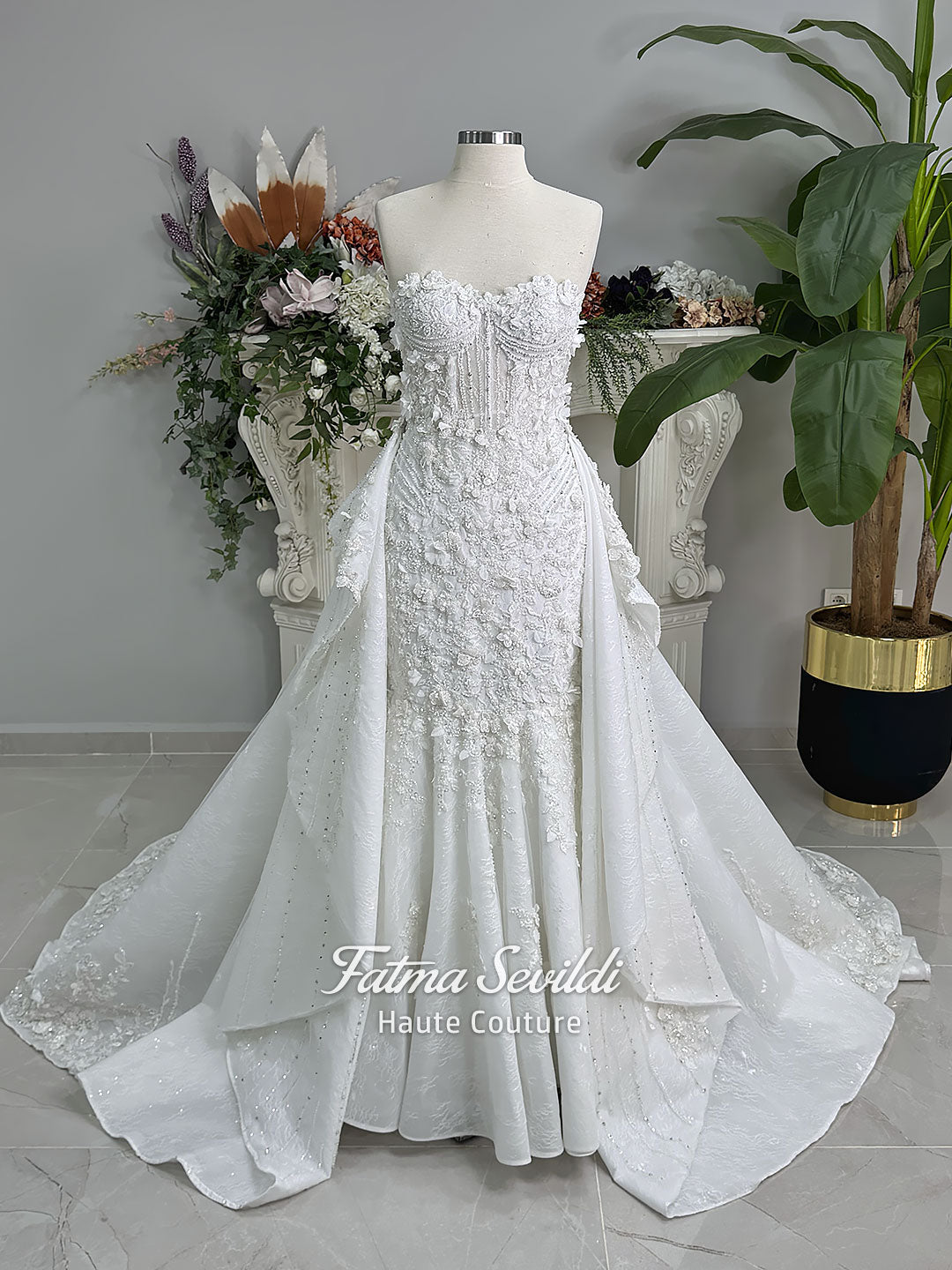 3-in-1 white hijab wedding dress with a beaded mermaid gown, detachable overskirt and long sleeve high-neck bridal topper. Convertible modest bridal set with dimensional floral lace and a coordinating lace veil.