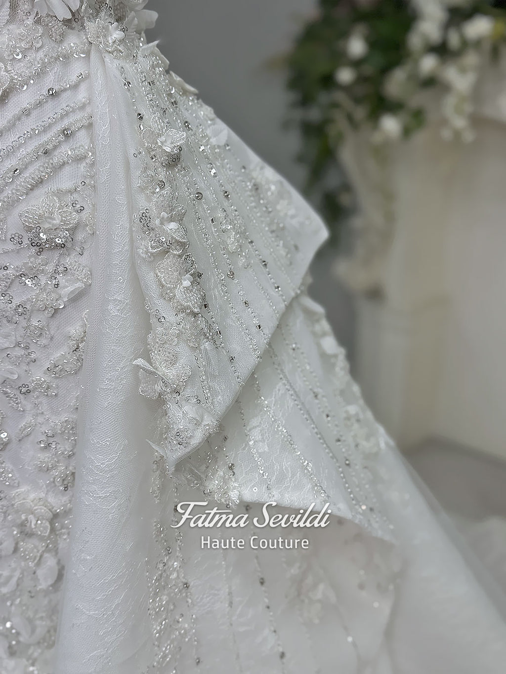 3-in-1 white hijab wedding dress with a beaded mermaid gown, detachable overskirt and long sleeve high-neck bridal topper. Convertible modest bridal set with dimensional floral lace and a coordinating lace veil.