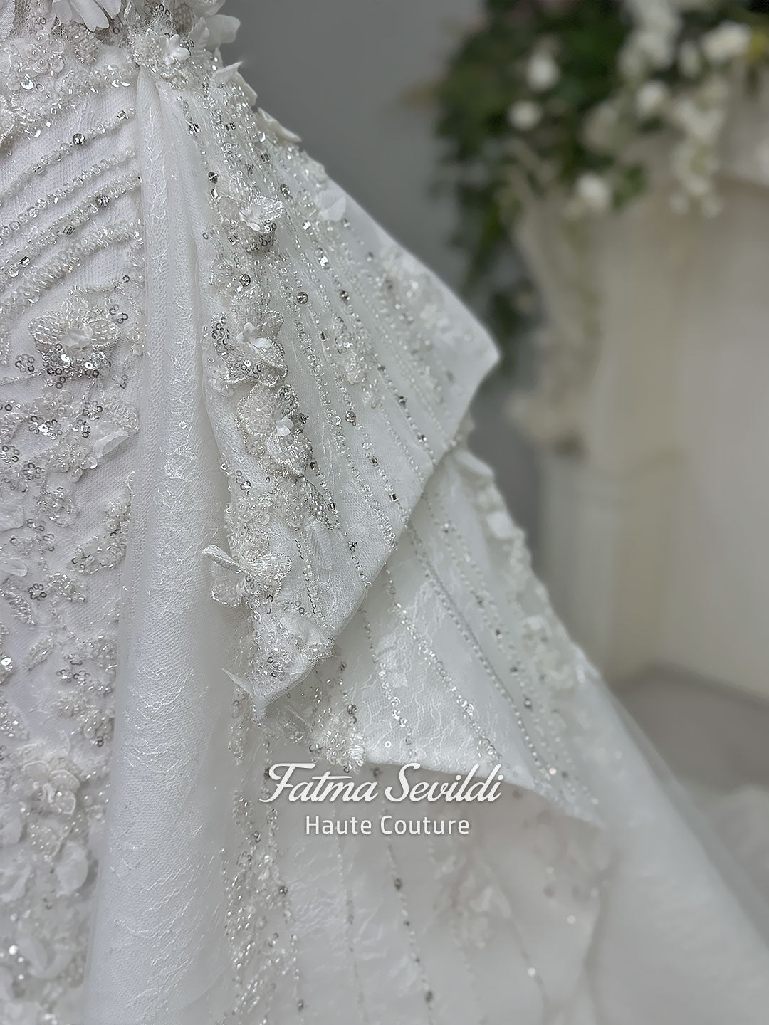 3-in-1 white hijab wedding dress with a beaded mermaid gown, detachable overskirt and long sleeve high-neck bridal topper. Convertible modest bridal set with dimensional floral lace and a coordinating lace veil.