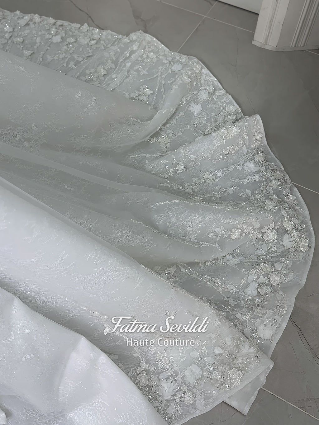 3-in-1 white hijab wedding dress with a beaded mermaid gown, detachable overskirt and long sleeve high-neck bridal topper. Convertible modest bridal set with dimensional floral lace and a coordinating lace veil.