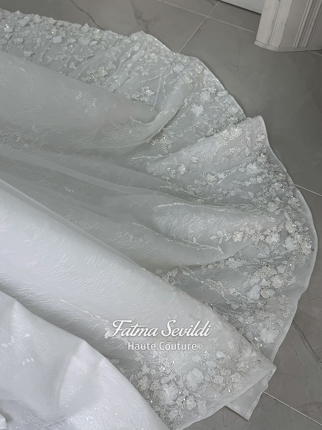 3-in-1 white hijab wedding dress with a beaded mermaid gown, detachable overskirt and long sleeve high-neck bridal topper. Convertible modest bridal set with dimensional floral lace and a coordinating lace veil.