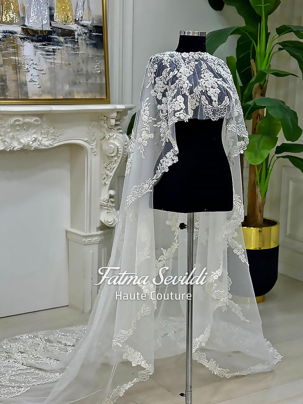 Elegant white lace bridal cape veil with floral embroidery and sheer train