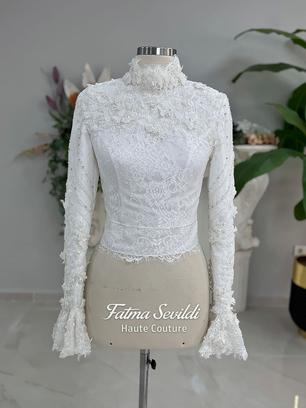 3-in-1 white hijab wedding dress with a beaded mermaid gown, detachable overskirt and long sleeve high-neck bridal topper. Convertible modest bridal set with dimensional floral lace and a coordinating lace veil.