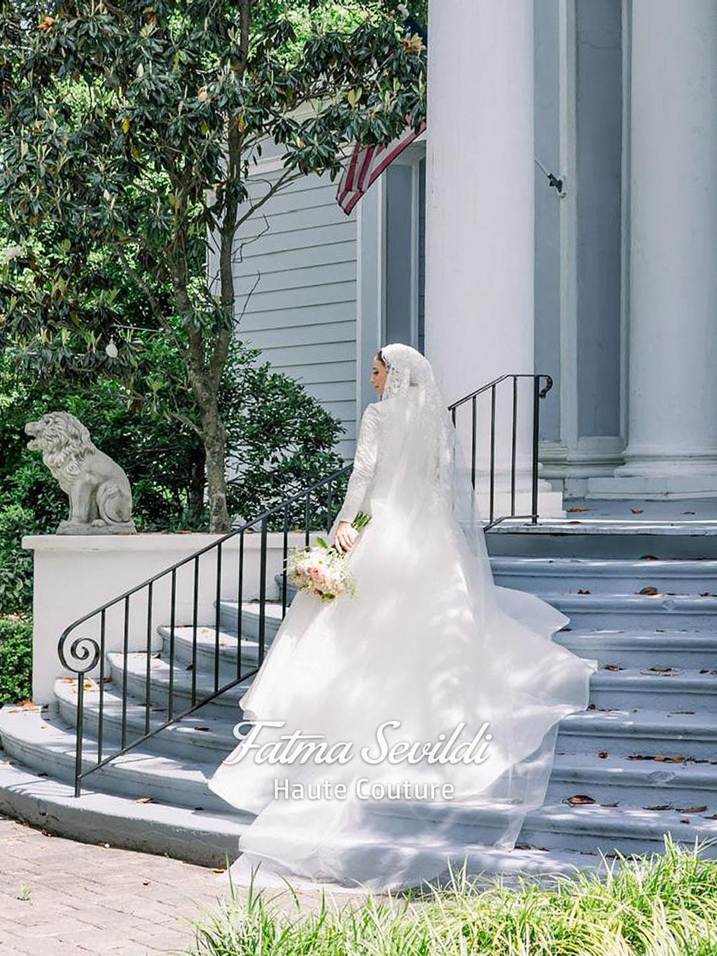 Elegant veiled hijab wedding dress with lace, beads, and long veil on bride descending steps