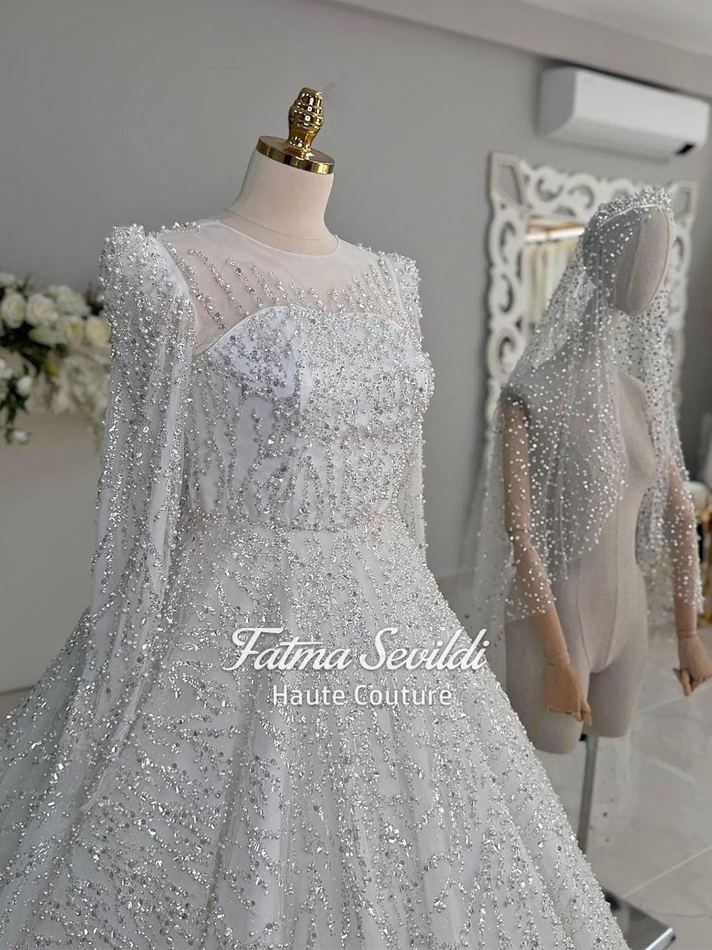 Luxury pearl ball gown bridal dress with silver beading and veil