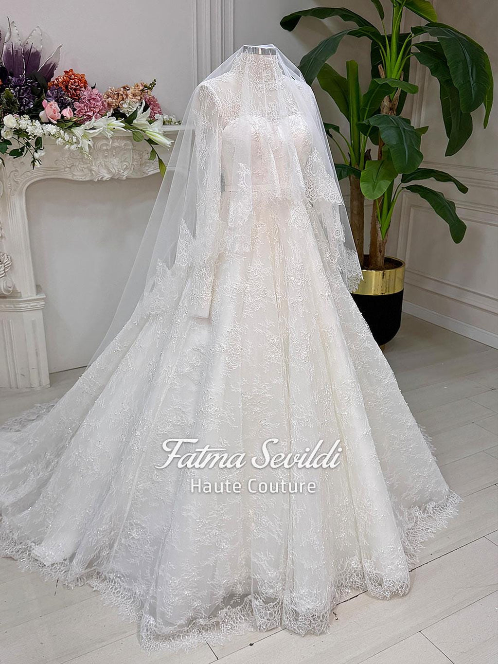 Elegant strapless lace wedding gown with floral embroidery, veil