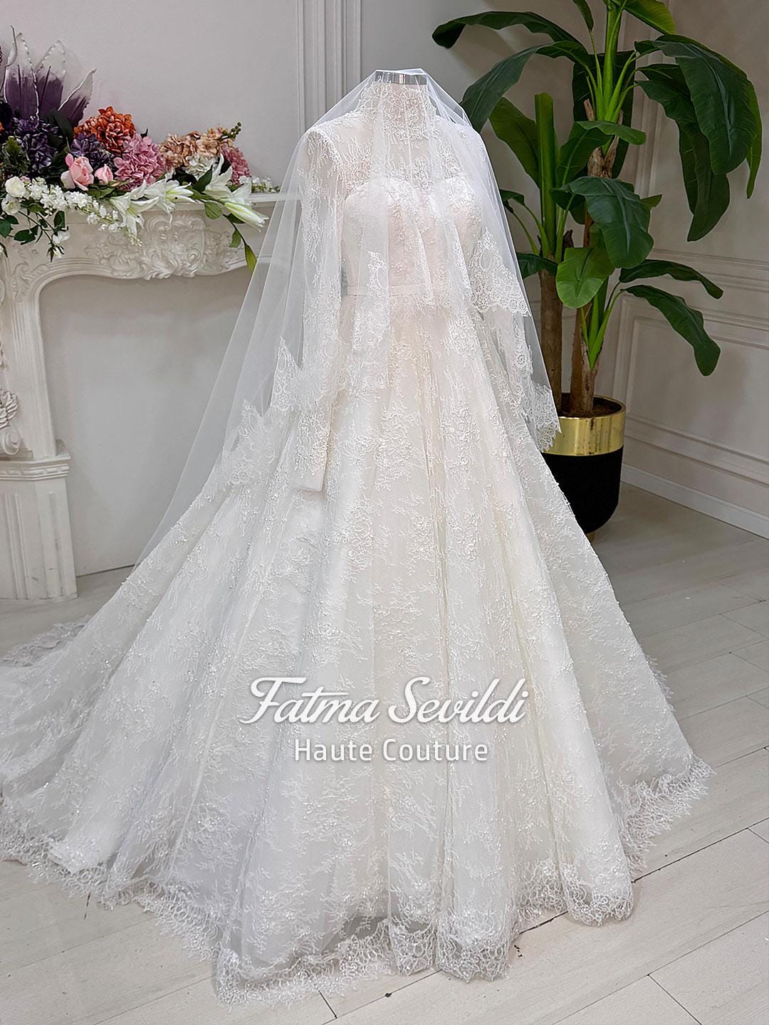 Elegant strapless lace wedding gown with floral embroidery, veil