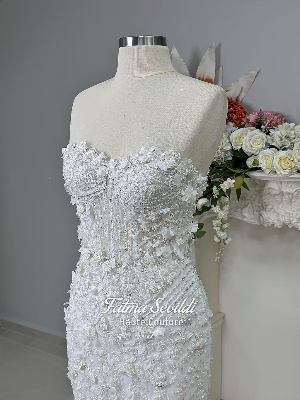 3-in-1 white hijab wedding dress with a beaded mermaid gown, detachable overskirt and long sleeve high-neck bridal topper. Convertible modest bridal set with dimensional floral lace and a coordinating lace veil.