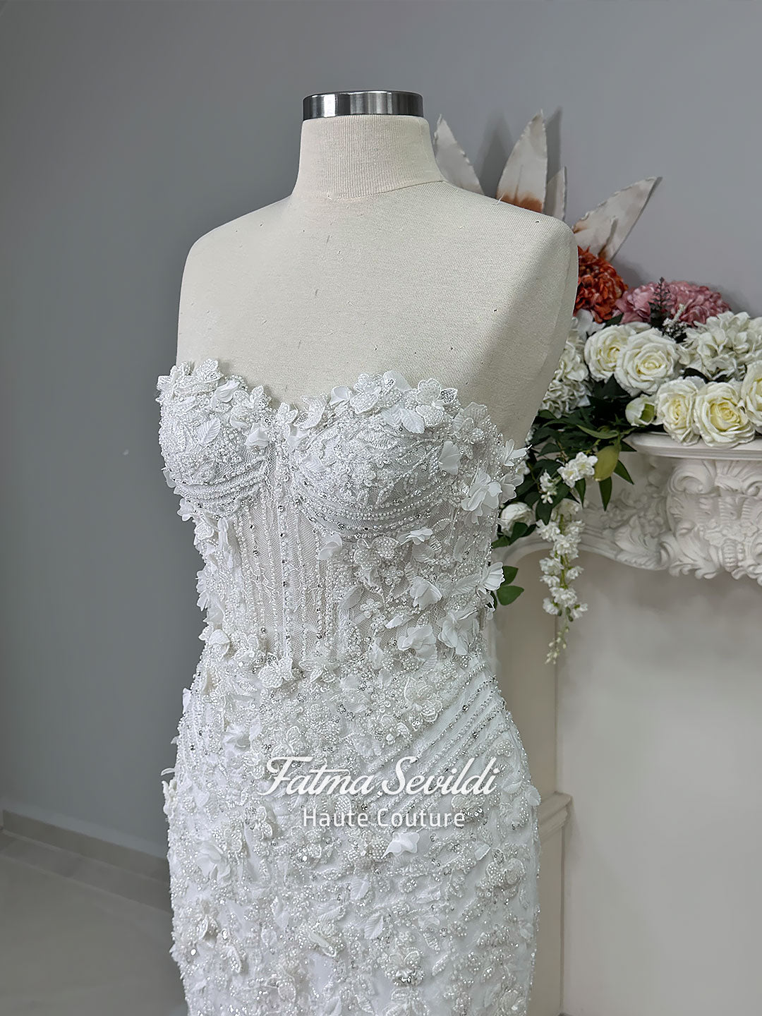 3-in-1 white hijab wedding dress with a beaded mermaid gown, detachable overskirt and long sleeve high-neck bridal topper. Convertible modest bridal set with dimensional floral lace and a coordinating lace veil.