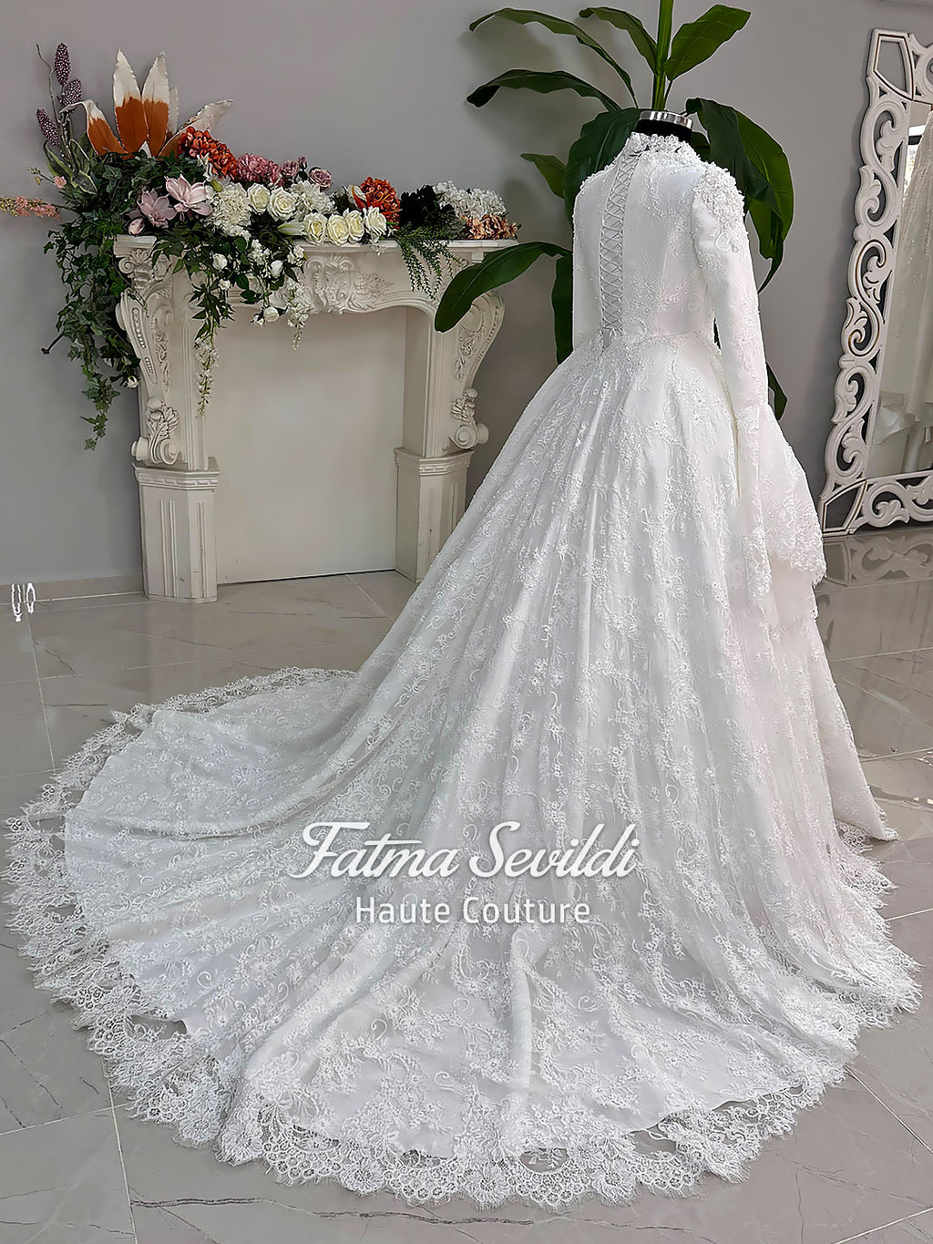 Luxury hijab wedding dress with long sleeves and high neckline, featuring beaded lace over a full ballgown silhouette and matching veiled bridal set. Couture modest bridal gown handmade in Türkiye.