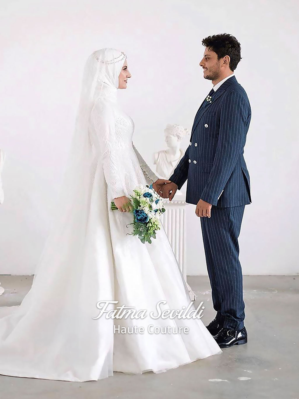 Luxury hijab wedding dress with high neck and long sleeves, featuring elegant beaded lace over a satin A-line silhouette for a modest bridal look.