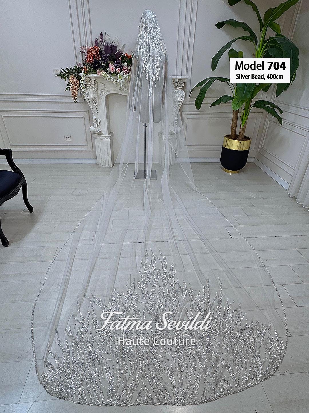 Sheer white cathedral bridal veil with hand-sewn silver beaded lace edges
