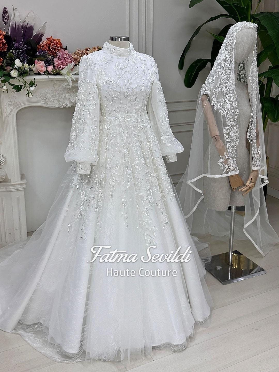 Veiled hijab wedding dress with high neck, balloon sleeves, beaded lace ballgown