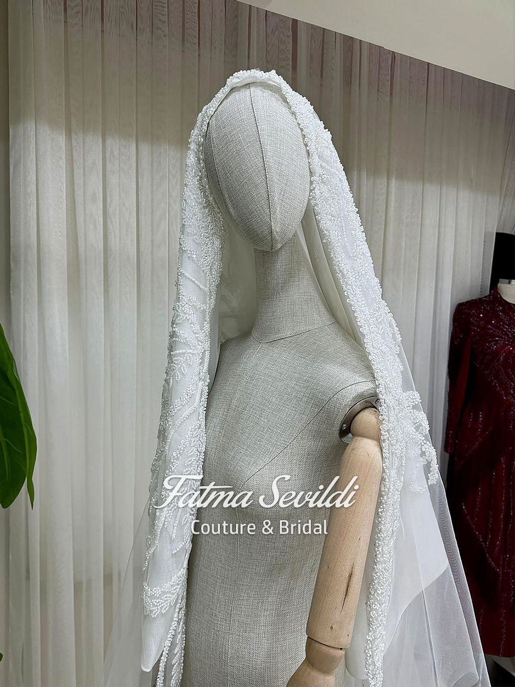 Delicate white lace bridal veil with beaded edges for modest Muslim gown
