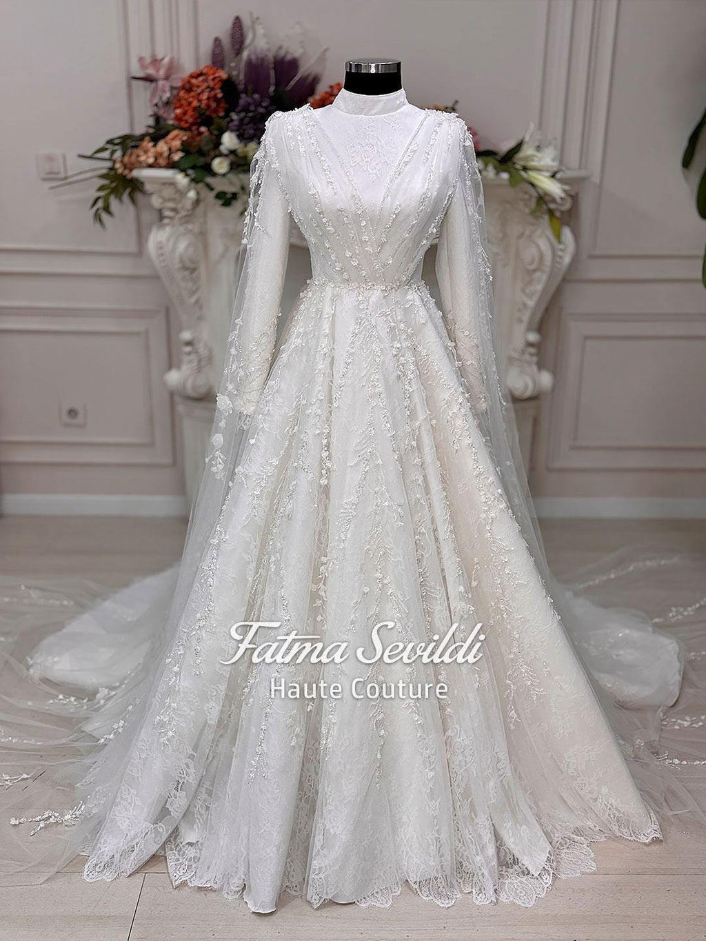 Elegant white floral lace Muslim wedding gown by Fatma Sevildi, long sleeve A-line with veil