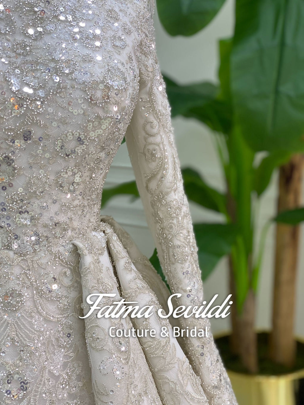 Shimmering silver beaded hijab wedding dress with lace floral embroidery