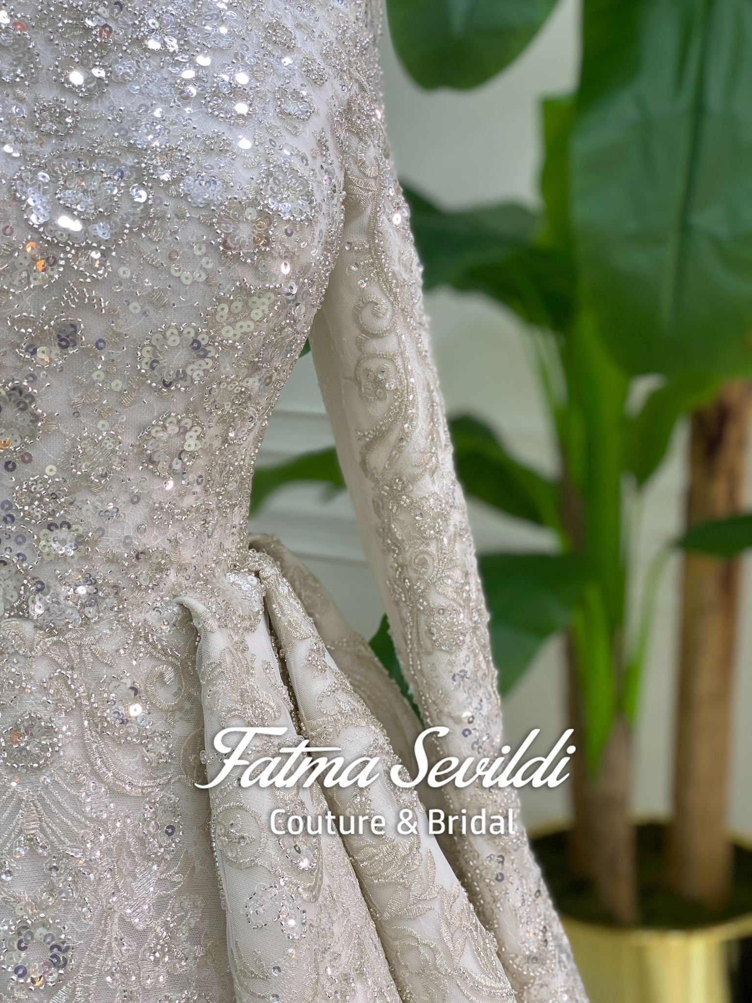 Shimmering silver beaded hijab wedding dress with lace floral embroidery