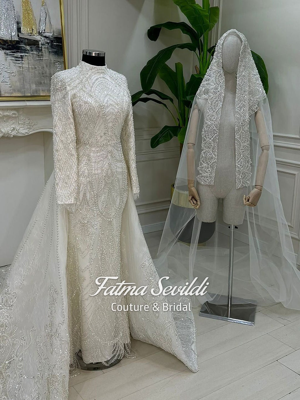 Veiled mermaid hijab wedding dress with beaded lace, high neck, long sleeves, and detachable skirt