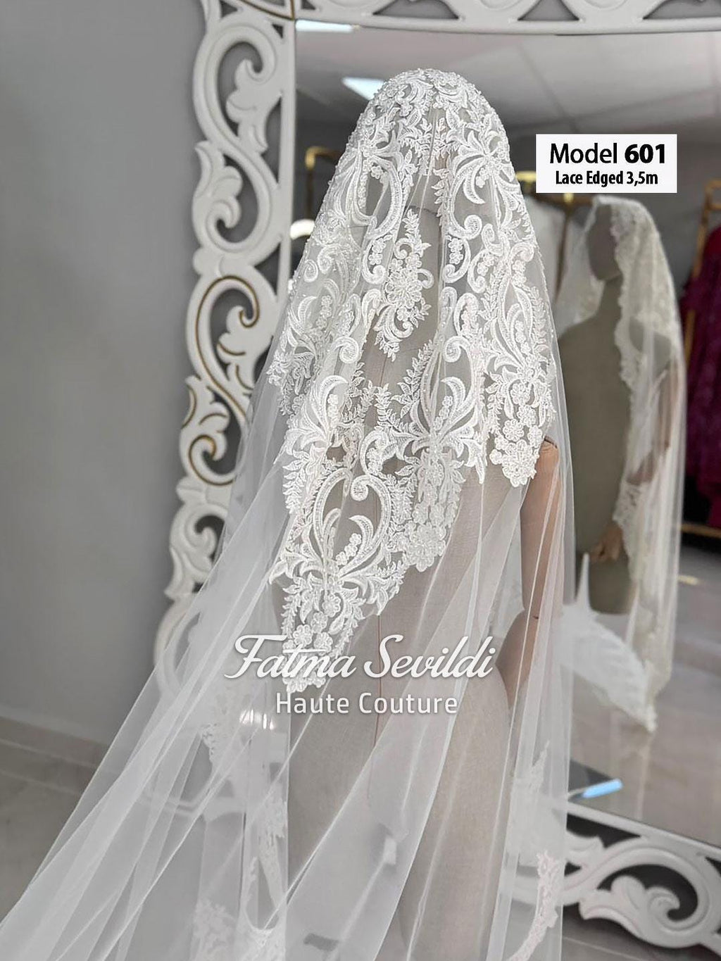 Delicate white lace-edged bridal veil model 601 with floral embroidery
