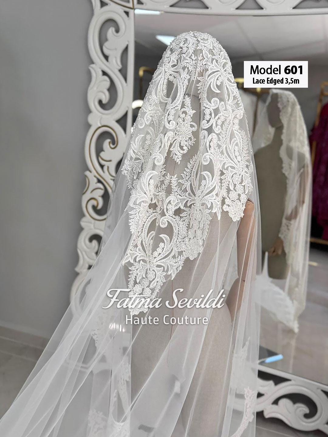 Delicate white lace-edged bridal veil model 601 with floral embroidery
