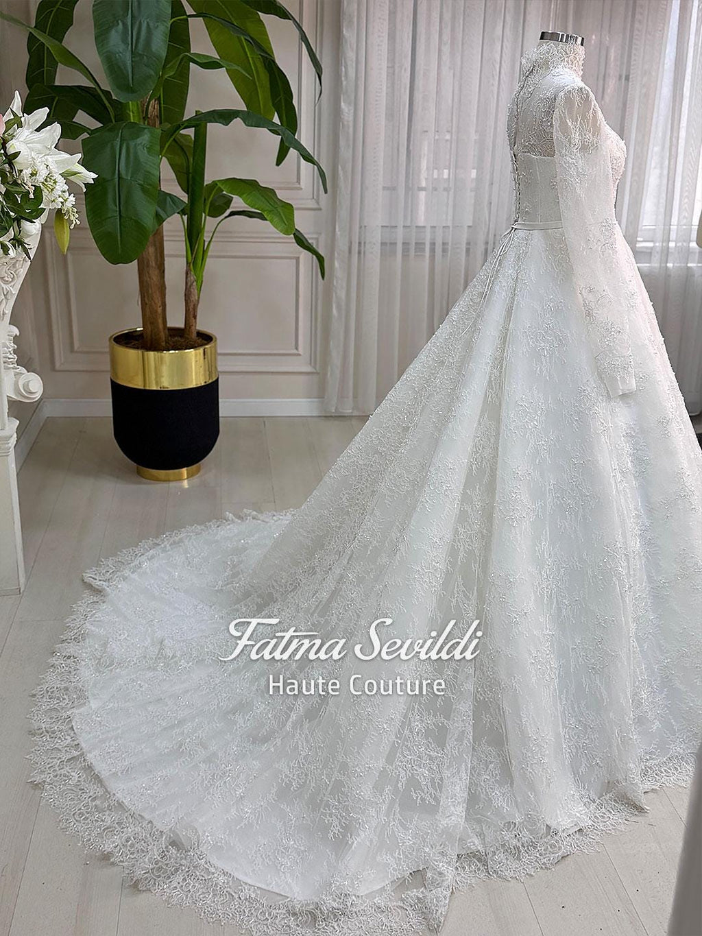 Elegant strapless beaded French lace wedding gown with corset back and veil