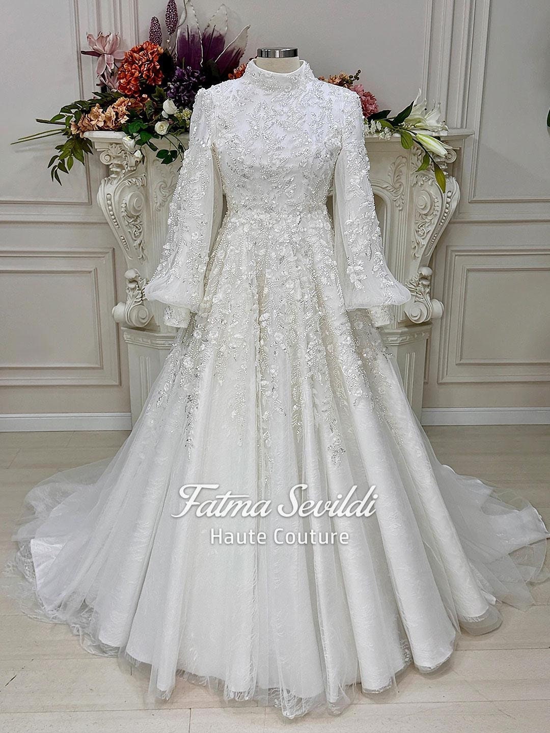 Veiled hijab wedding dress with balloon sleeves and high neck beaded lace