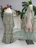 Sage green evening dress with beaded floral lace, a sweetheart neckline and long sleeves with flared lace cuffs, displayed on a mannequin.
