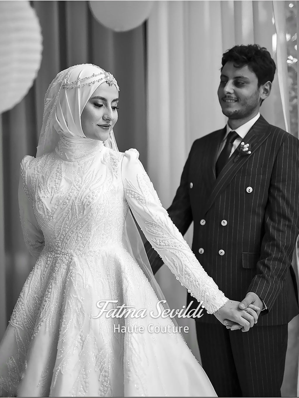 Luxury hijab wedding dress with high neck and long sleeves, featuring elegant beaded lace over a satin A-line silhouette for a modest bridal look.