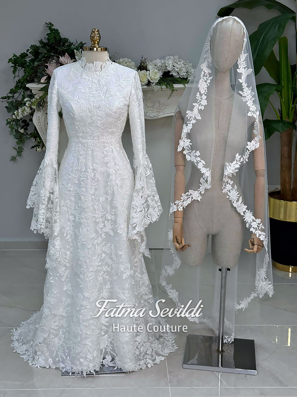 Veiled hijab wedding dress with high neck, long sleeves, and beaded floral lace in an elegant A-line couture silhouette.