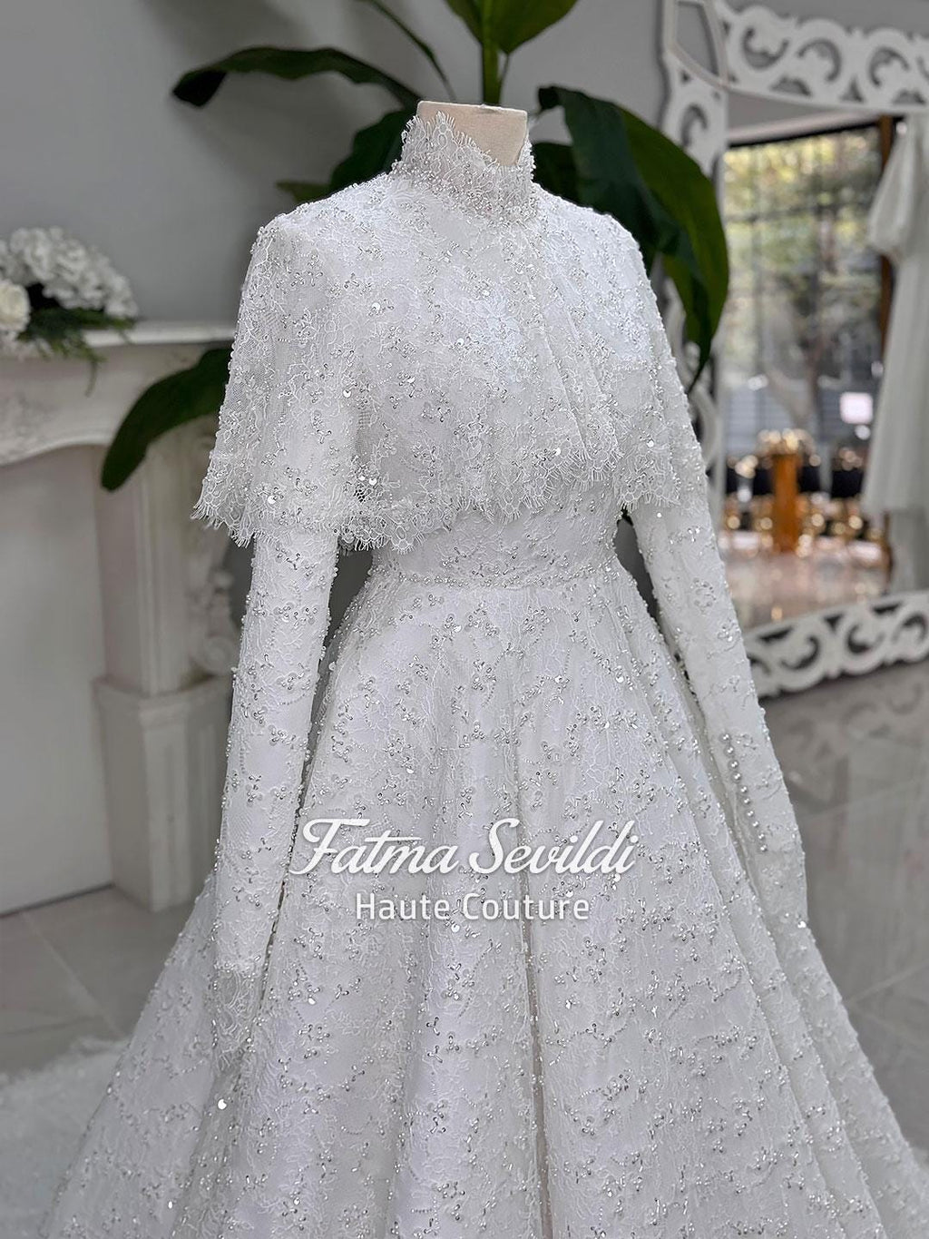 Elegant beaded lace Muslim wedding gown with high neckline and A-line silhouette