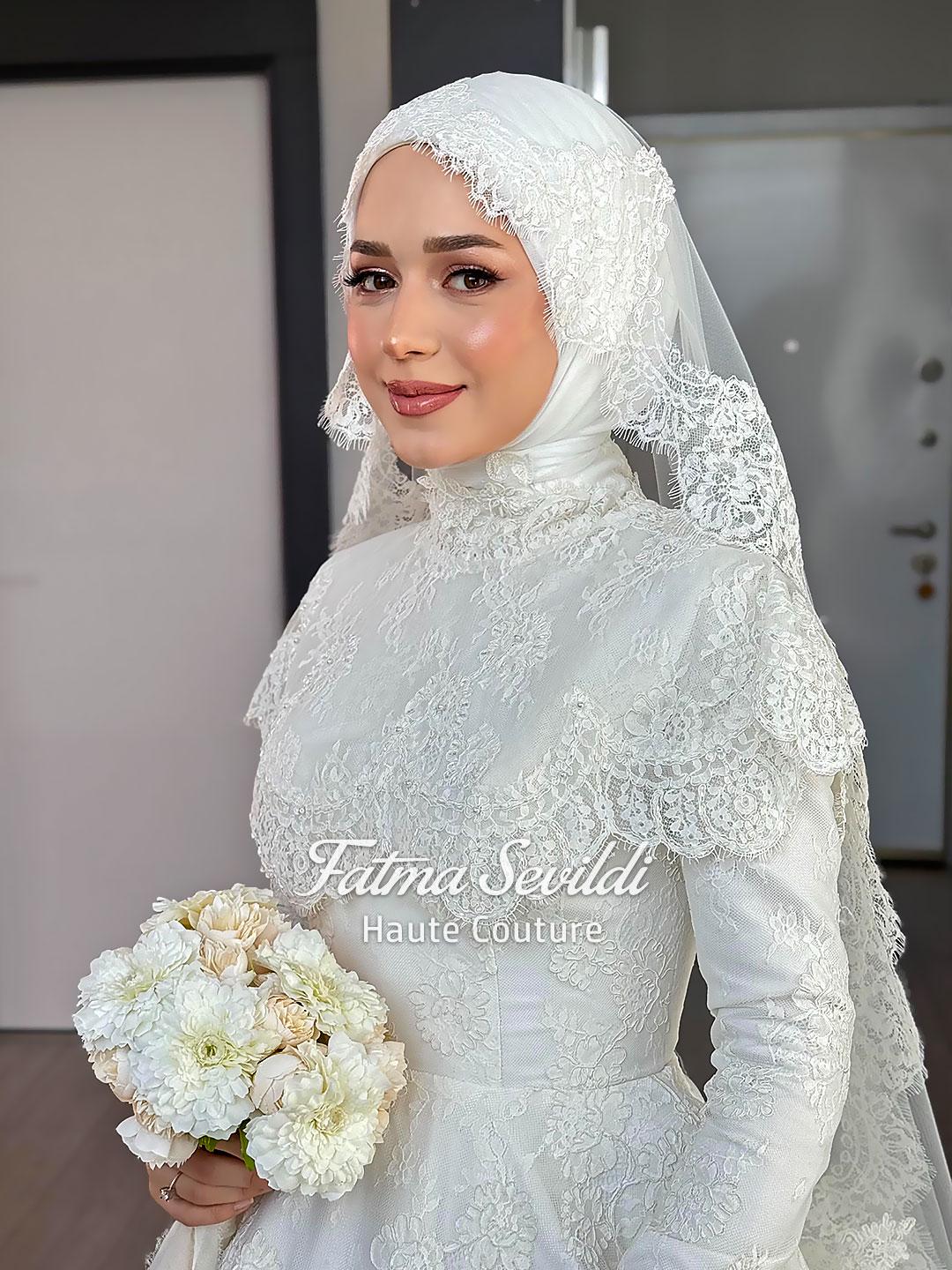 Elegant white lace Muslim bridal gown with floral embroidery and veil