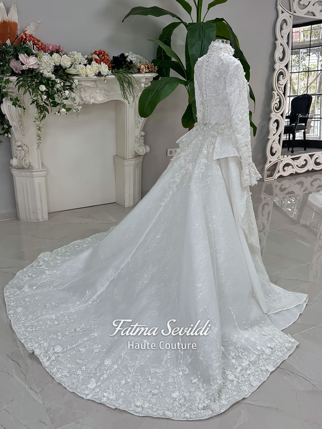 3-in-1 white hijab wedding dress with a beaded mermaid gown, detachable overskirt and long sleeve high-neck bridal topper. Convertible modest bridal set with dimensional floral lace and a coordinating lace veil.