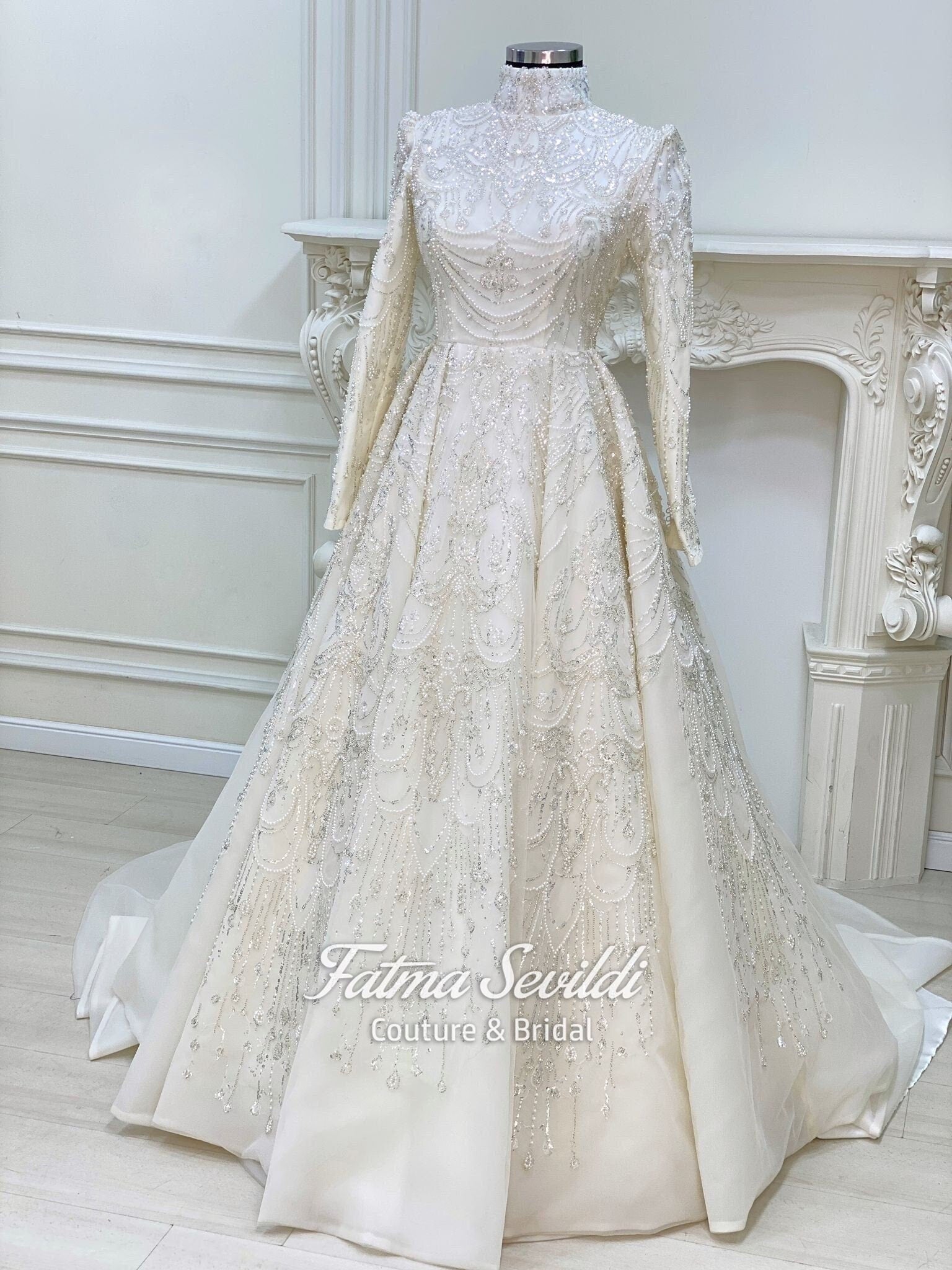 Elegant ivory Muslim wedding gown with beaded lace high neck long sleeves